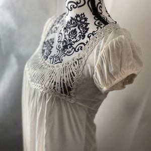 FRANCESCA'S delicate baby doll dress.